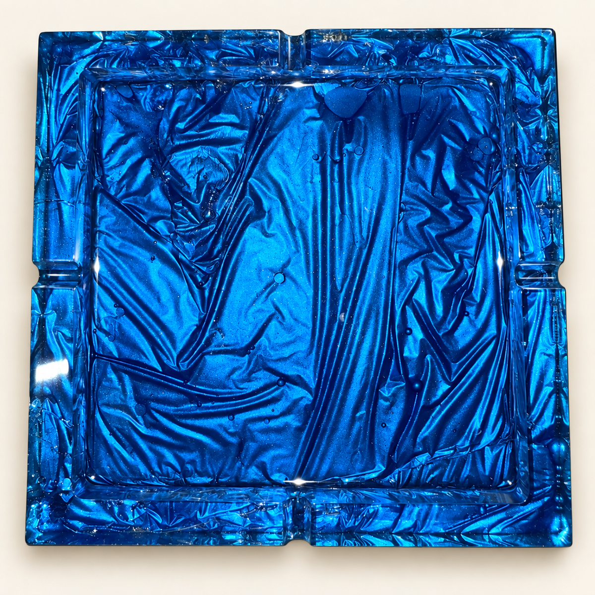 deep blue texture large square resin ashtray with four notches on cream background