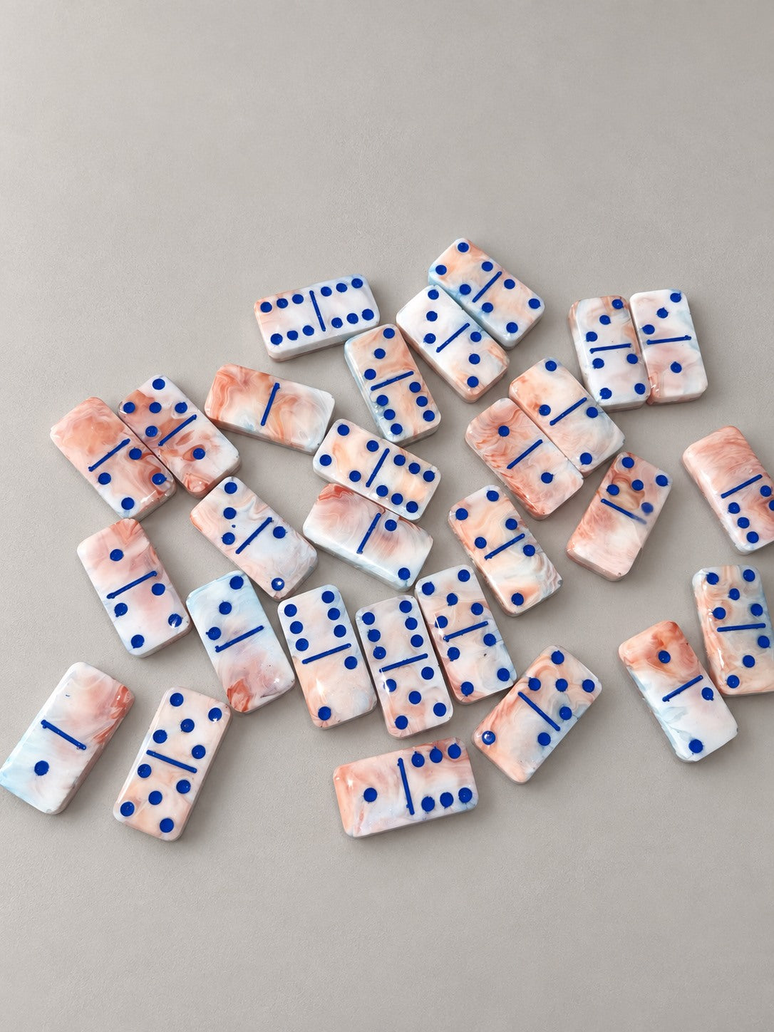Example of resin domino fronts and color finish; personalized photo backs are made to order