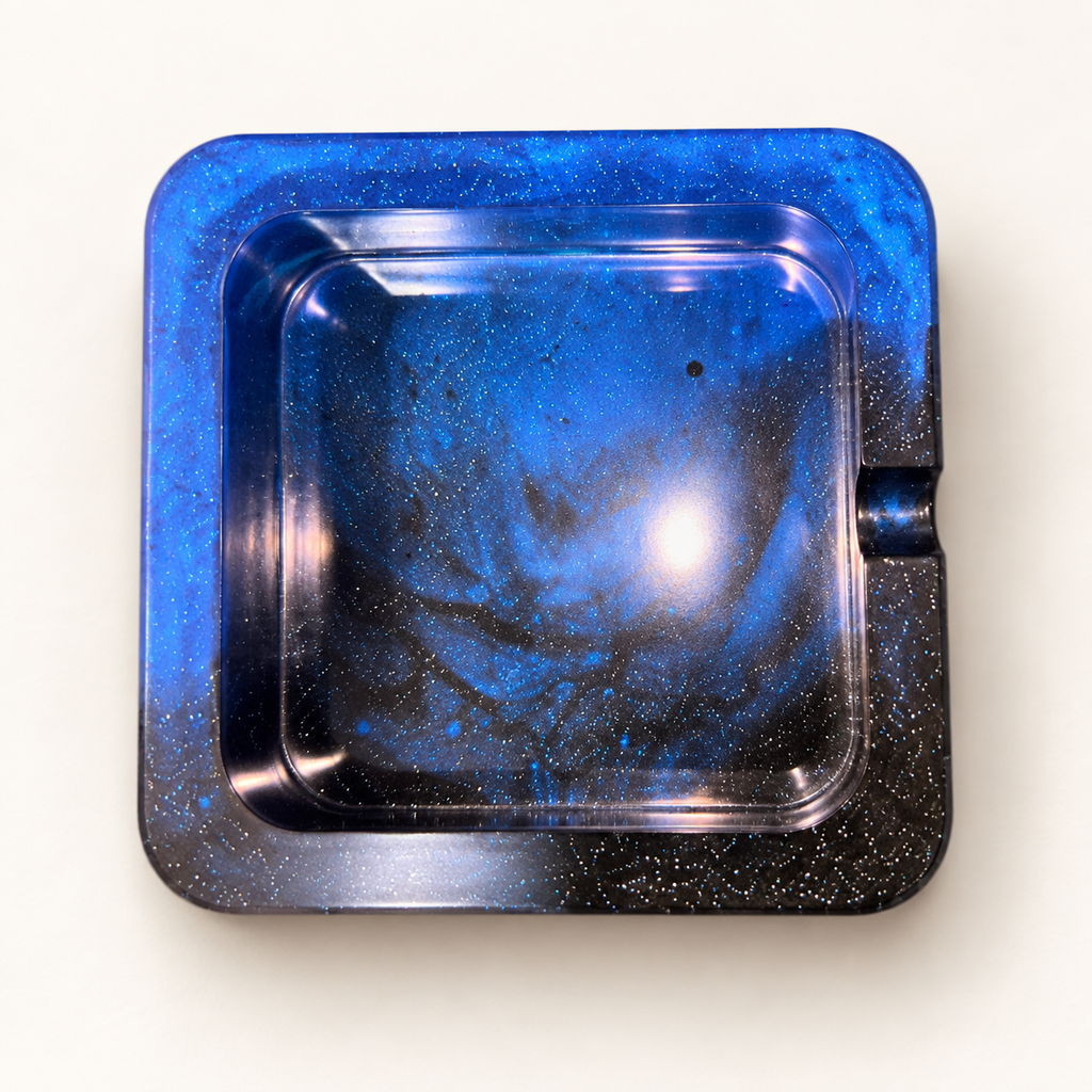 blue black glitter small square resin ashtray with one notch on cream background