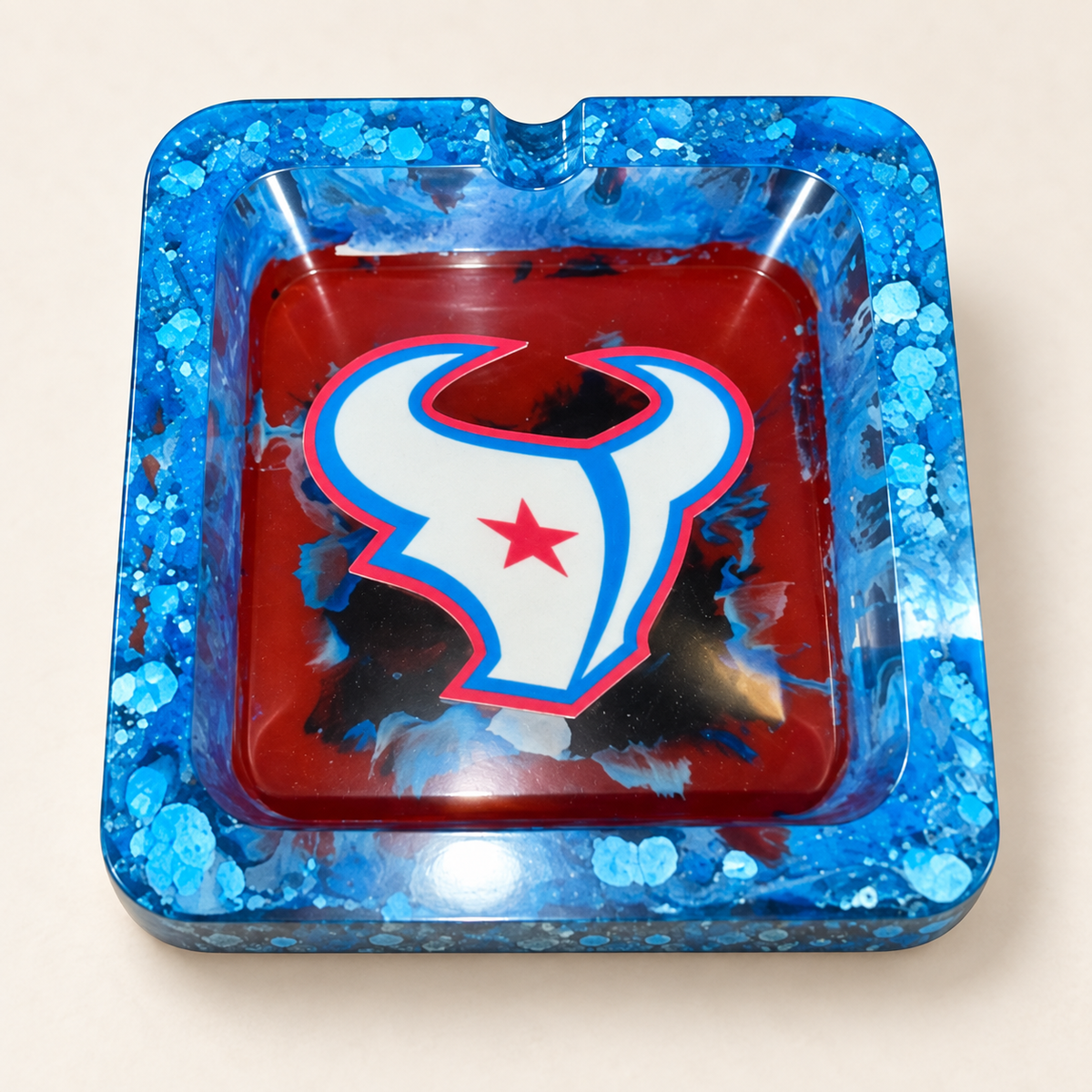 texans blue flakes red small square resin ashtray with one notch on cream background